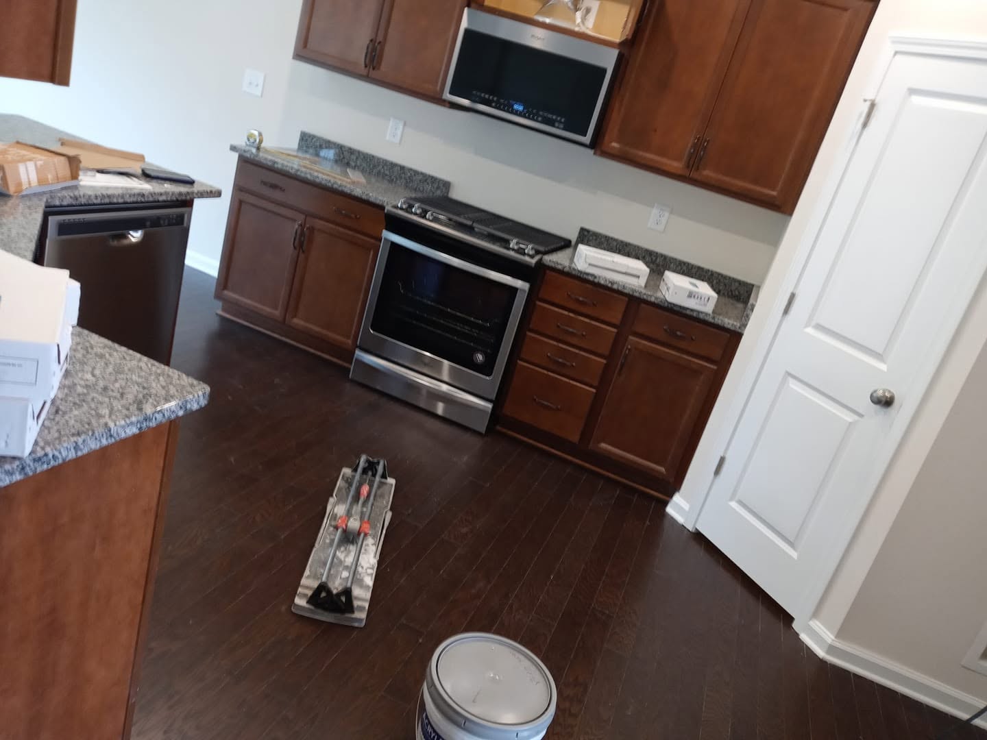 Dark hardwood floor installation in kitchen